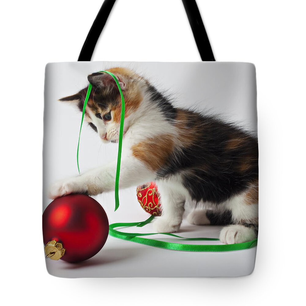Calico Kitten Christmas Ornaments Tote Bag featuring the photograph Calico kitten and Christmas ornaments by Garry Gay