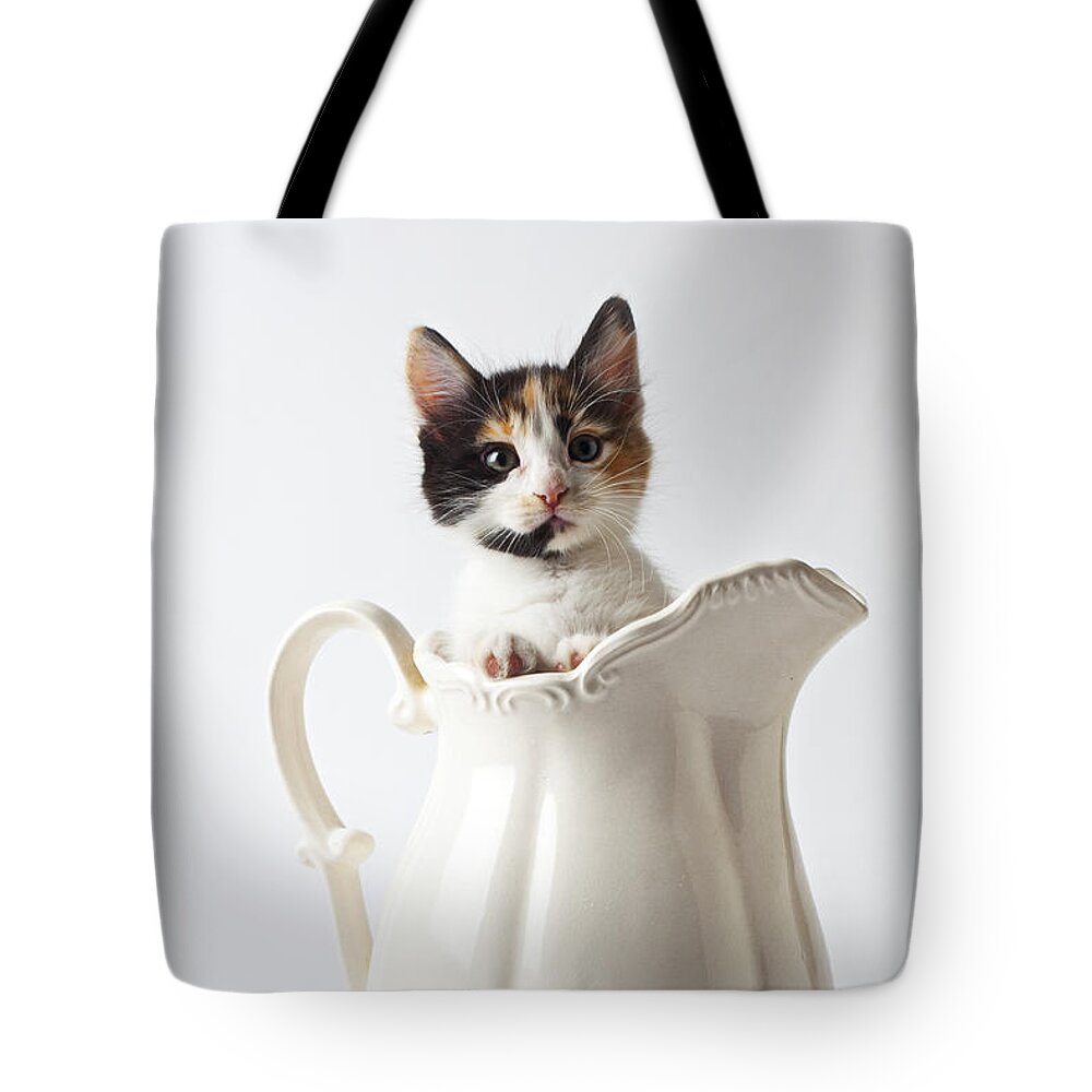 Calico Kitten White Pitcher Tote Bag featuring the photograph Calico kitten in white pitcher by Garry Gay