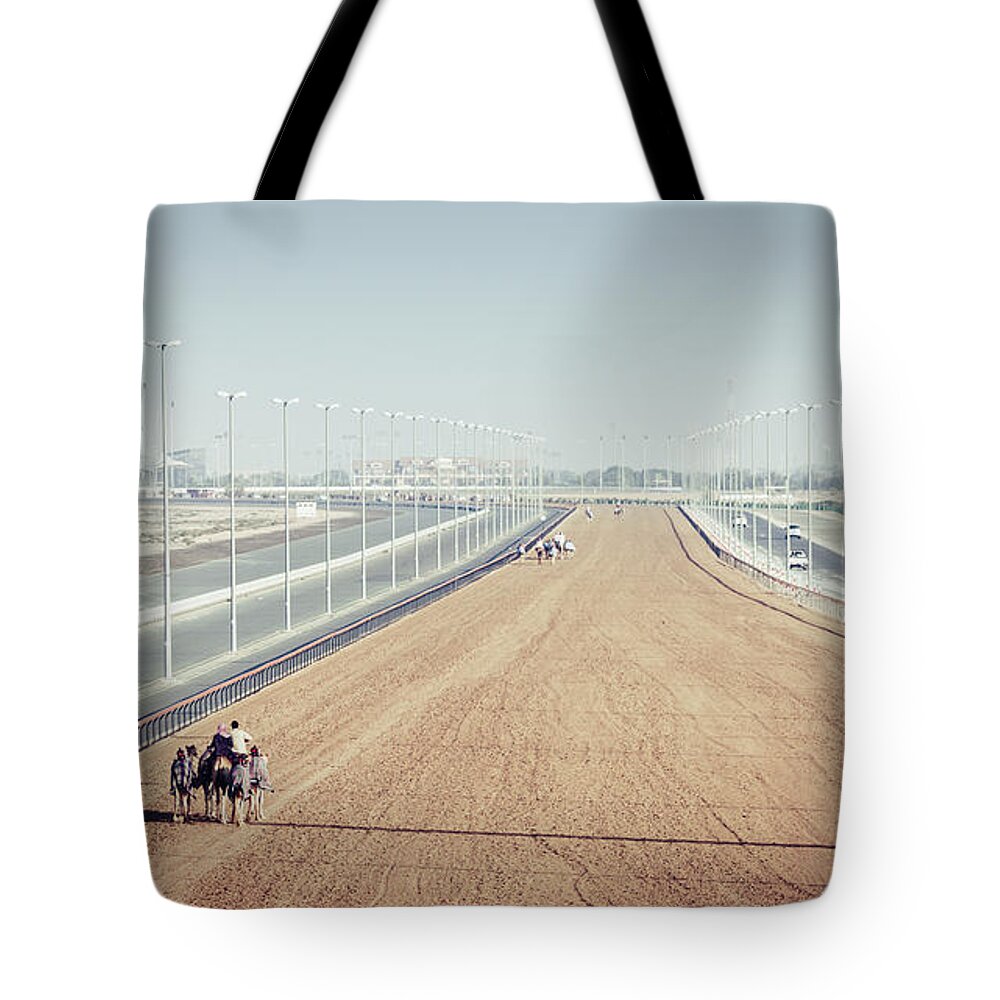 Al Marmoom Tote Bag featuring the photograph Camel racing track in Dubai by Alexey Stiop