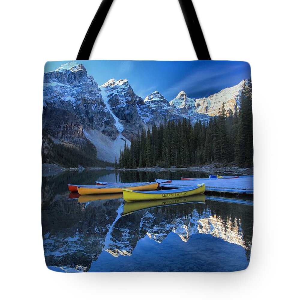 Moraine Lake Tote Bag featuring the photograph Canoes In Paradise by Adam Jewell