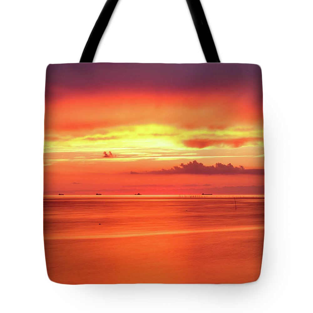 Sunset Tote Bag featuring the photograph Cargo Line by Nicole Lloyd