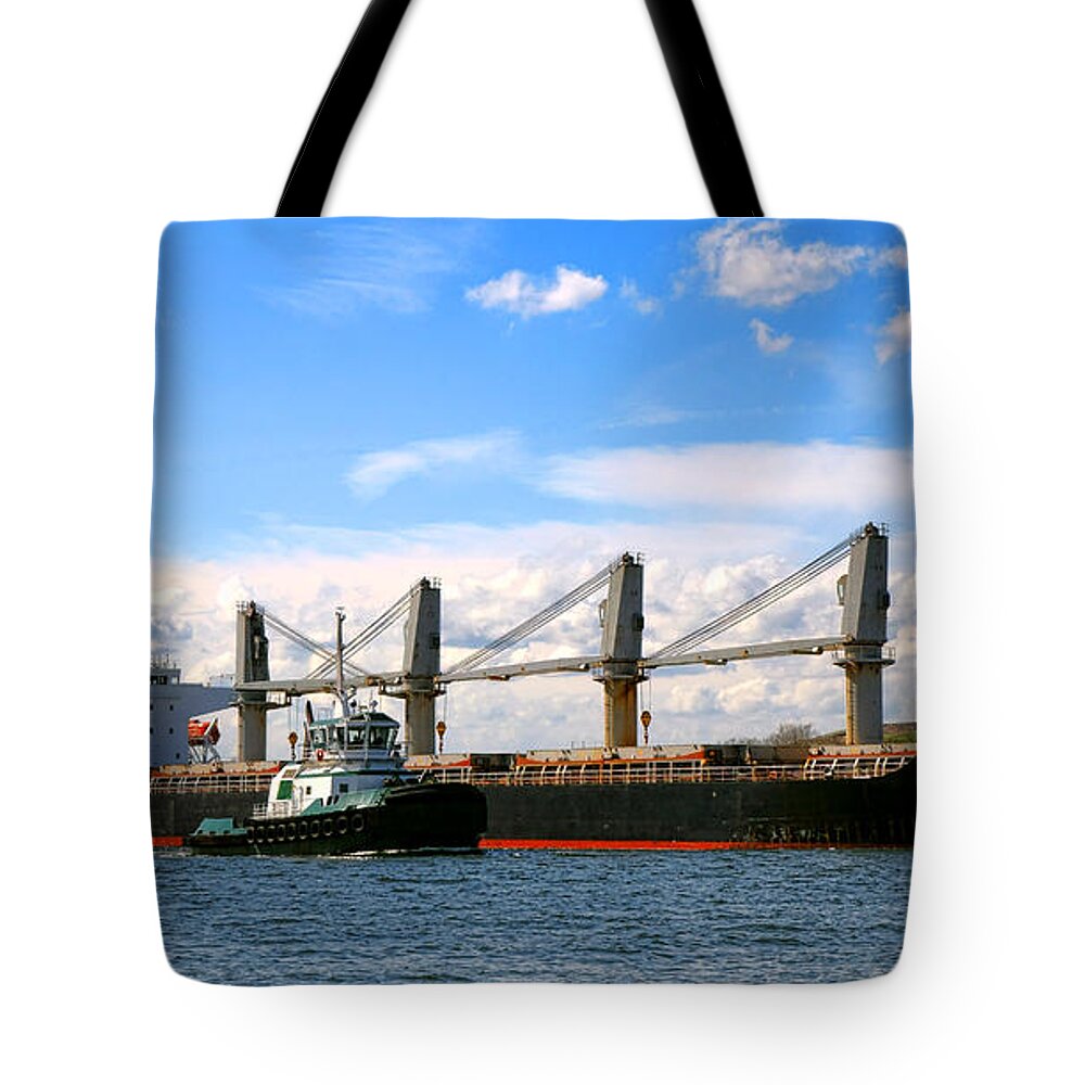 Freight Tote Bag featuring the photograph Cargo Ship and Tugboats by Olivier Le Queinec