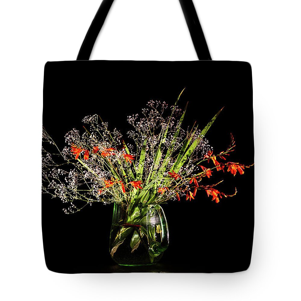 Baby's Breath Tote Bag featuring the photograph Cascade of white and orange. by Torbjorn Swenelius