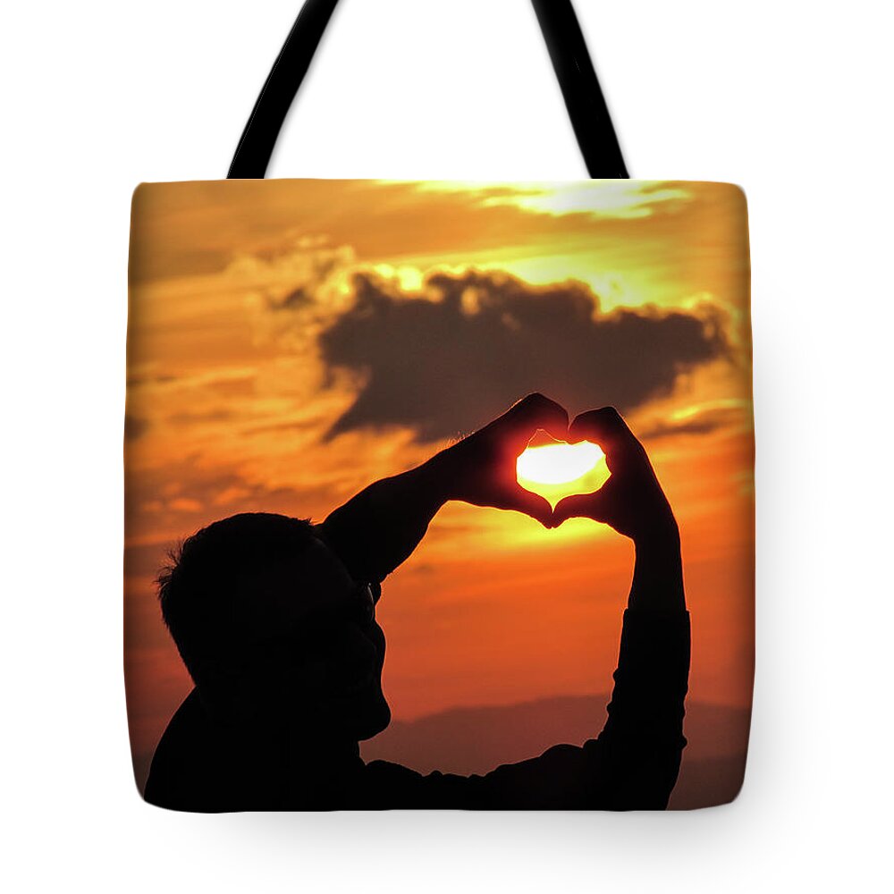 Sunset Tote Bag featuring the photograph Catching the Sun by Cesar Vieira