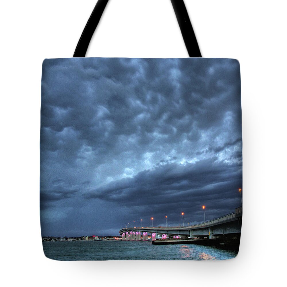 Clouds Tote Bag featuring the photograph Causeway clouds by John Loreaux