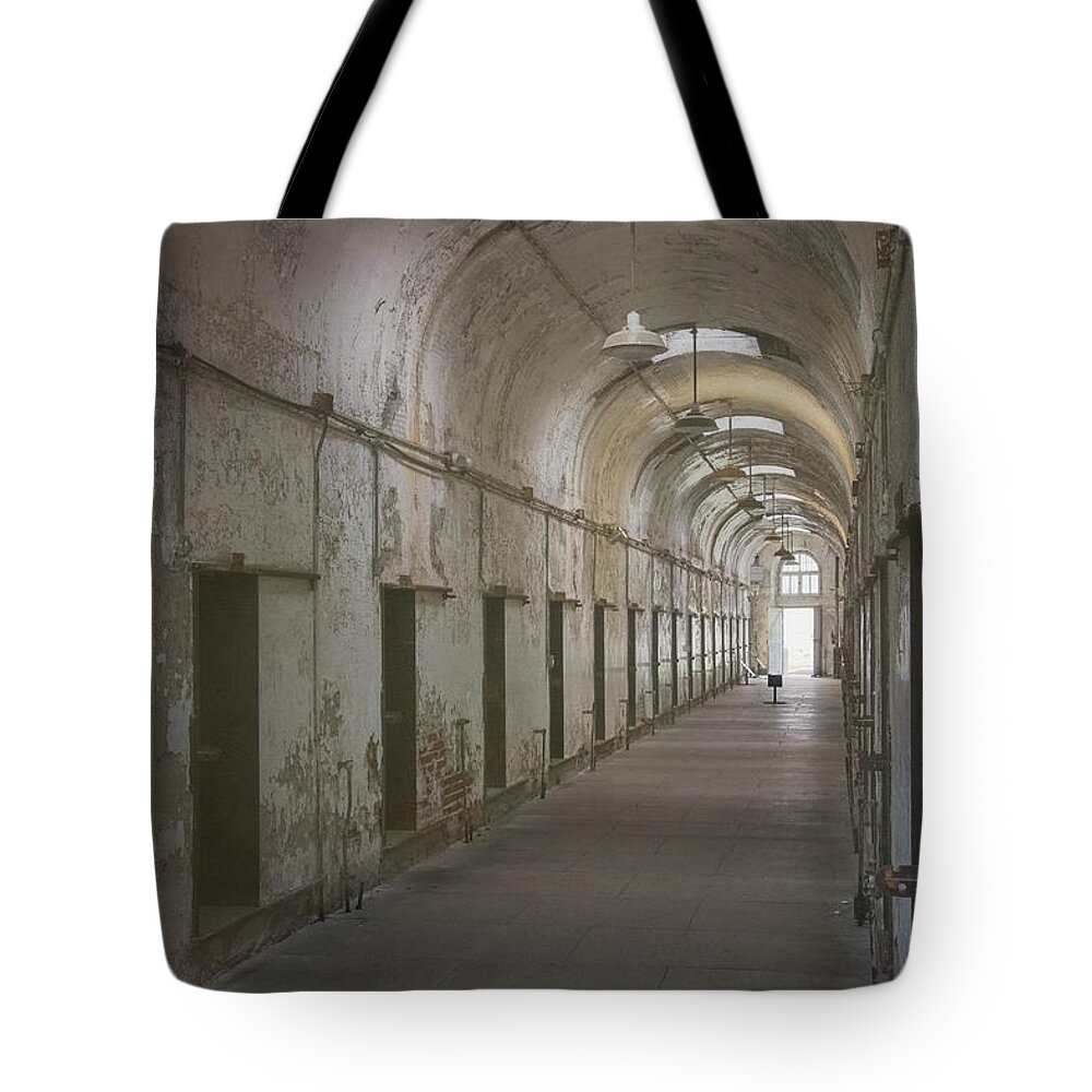 Eastern State Penitentiary Tote Bag featuring the photograph Cellblock Hallway by Tom Singleton