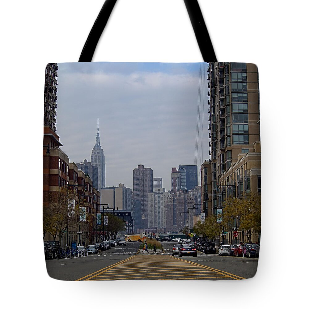 Citylights Tote Bag featuring the photograph Center Blvd by Newwwman