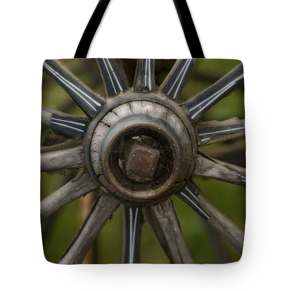 Wagon Wheel Tote Bag featuring the photograph Center of the West by Amanda Smith