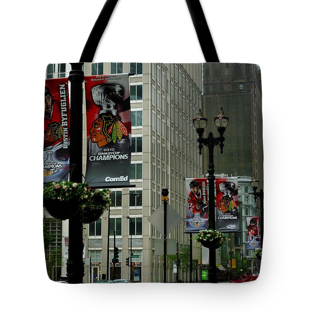 Chicago Blackhawk Flags Tote Bag featuring the photograph Chicago Blackhawk Flags by Ely Arsha