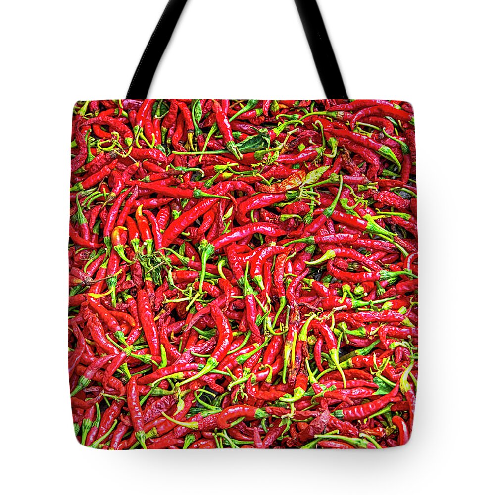 Chillies Tote Bag featuring the photograph Chillies by Charuhas Images