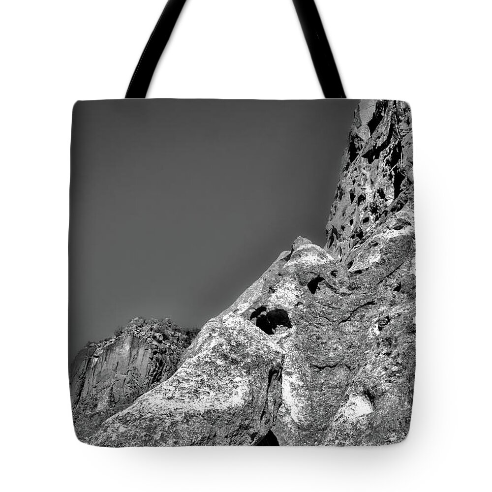 Bandelier Tote Bag featuring the photograph Cliffs at Bandelier #3 by Stuart Litoff