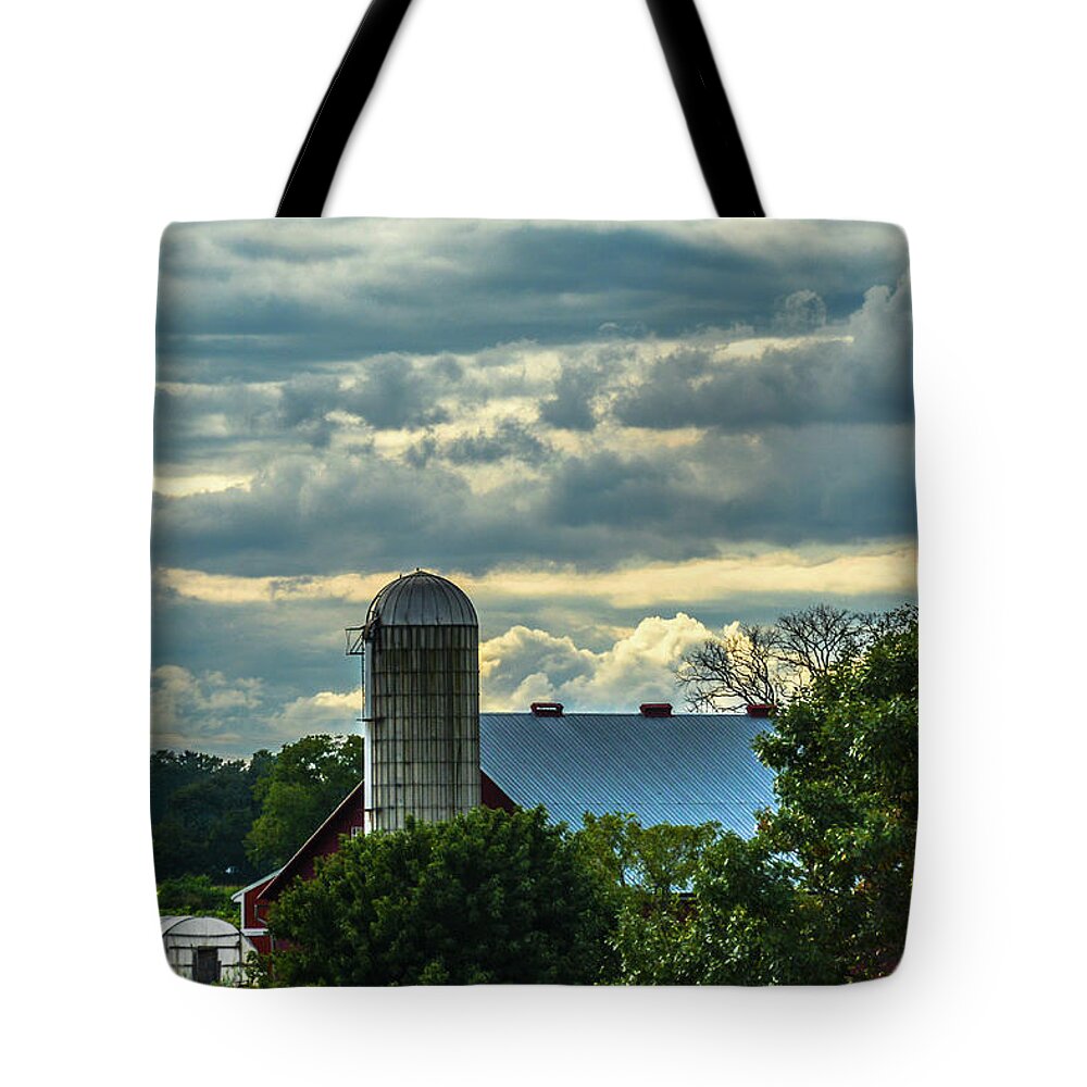 Cloudscape Tote Bag featuring the photograph Clouds and Light on a Barn by Tana Reiff