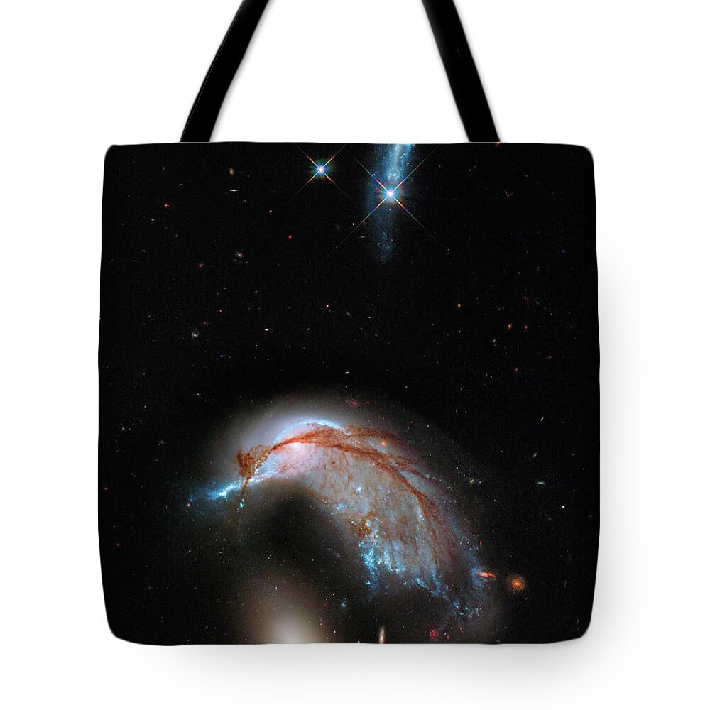 Cosmos Tote Bag featuring the photograph Colliding Galaxy by Marco Oliveira