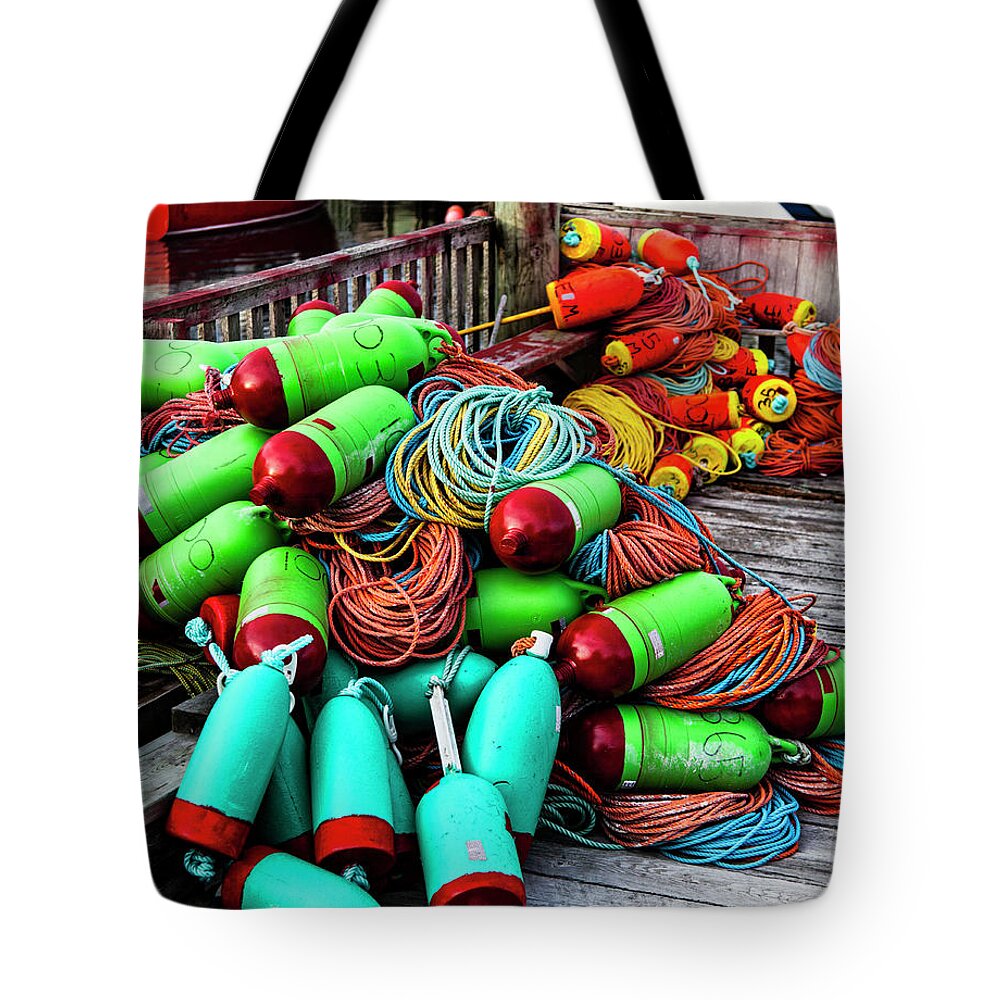 Buoys Tote Bag featuring the photograph Colorful Buoys on the Wharf, Peggy's Cove by Carol Leigh