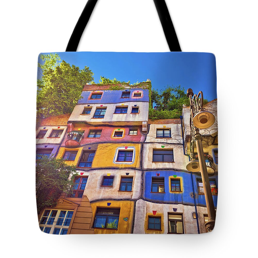Vienna Tote Bag featuring the photograph Colorful Hundertwasserhaus architecture of Vienna view by Brch Photography