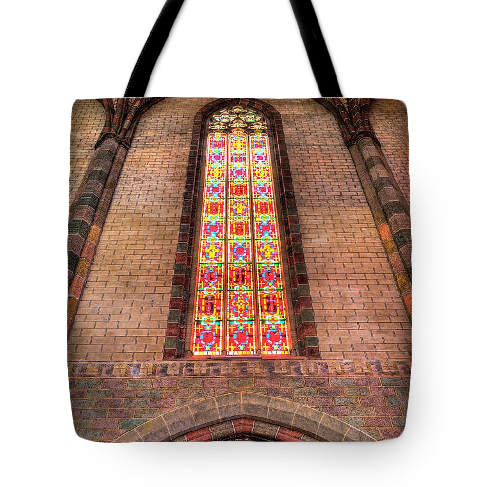 Arches Tote Bag featuring the photograph Coloured glass in the Church of the Jacobins in Toulouse by Semmick Photo