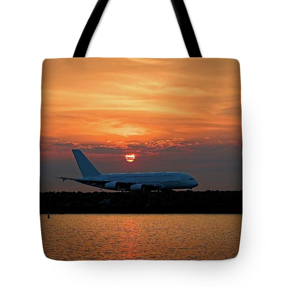 Sunnypicsoz Tote Bag featuring the photograph Commercial Jet Aircraft at Sunset by Geoff Childs