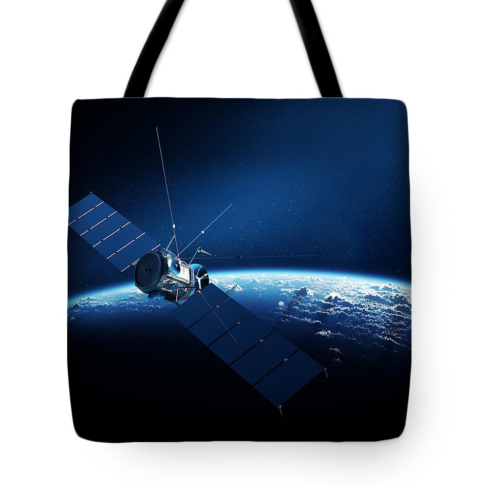 Satellite Tote Bag featuring the digital art Communications satellite orbiting earth by Johan Swanepoel