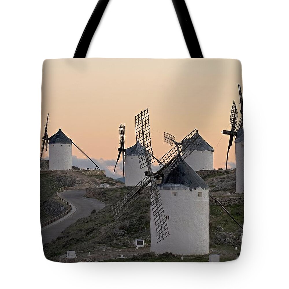 Windmills; Mills; Wind Mills; White; Architecture; Architectural; Buildings; Nostalgic; Nostalgia; Medieval; Middle Ages; Old; Antique; Ancient; History; Historical; Past; Landmark; Monument; Symbol; Scene; Scenery; Energy; Landscape; Rural; Europe; European; Spanish; Spain; Sky Tote Bag featuring the photograph Consuegra Windmills by Heiko Koehrer-Wagner