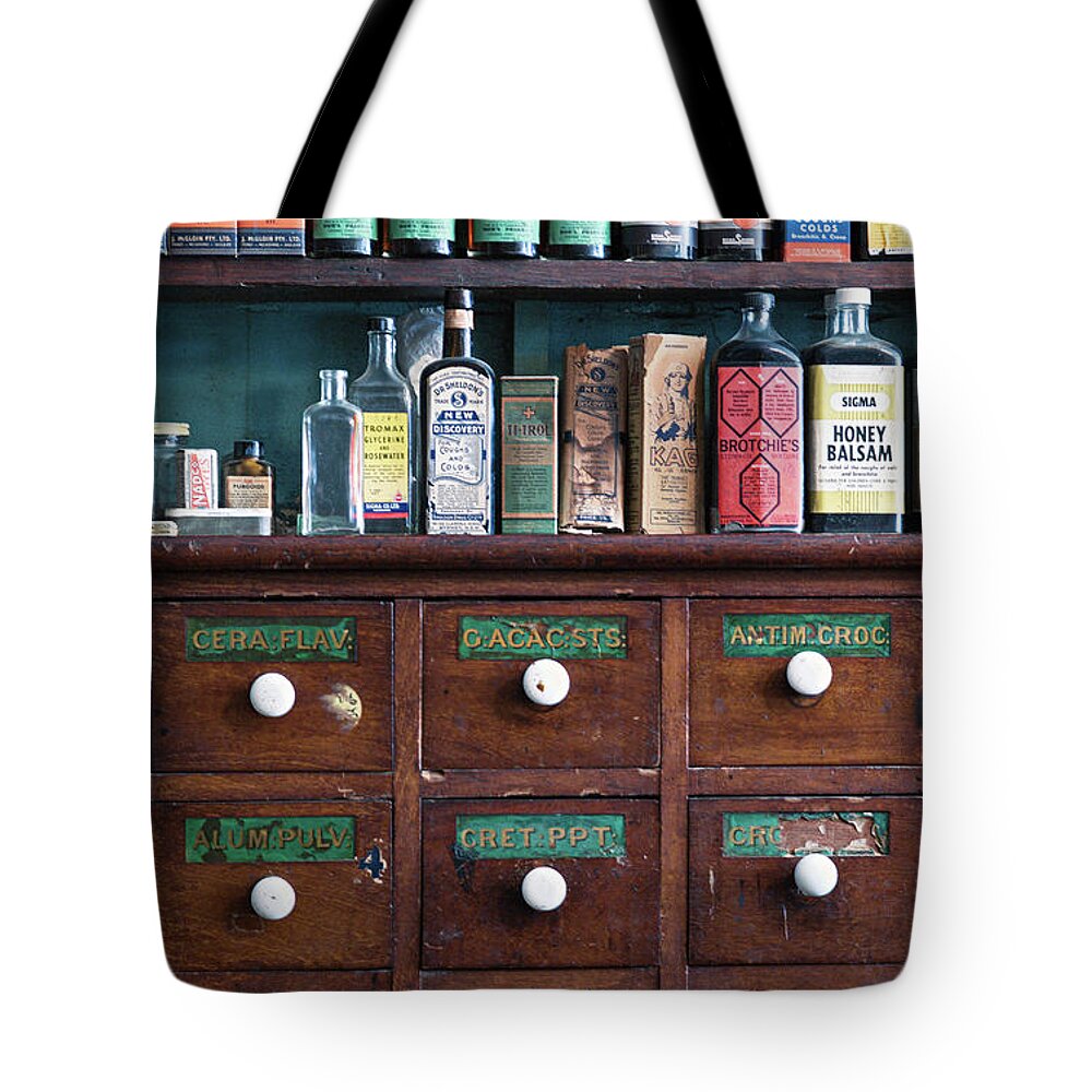 Chemist Tote Bag featuring the photograph Cough mixtures by Russell Brown