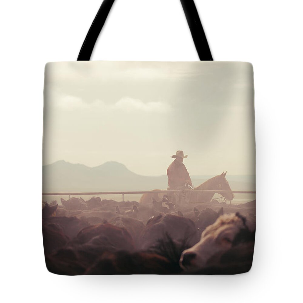 Quarter Tote Bag featuring the photograph Cowboy Dawn by Todd Klassy