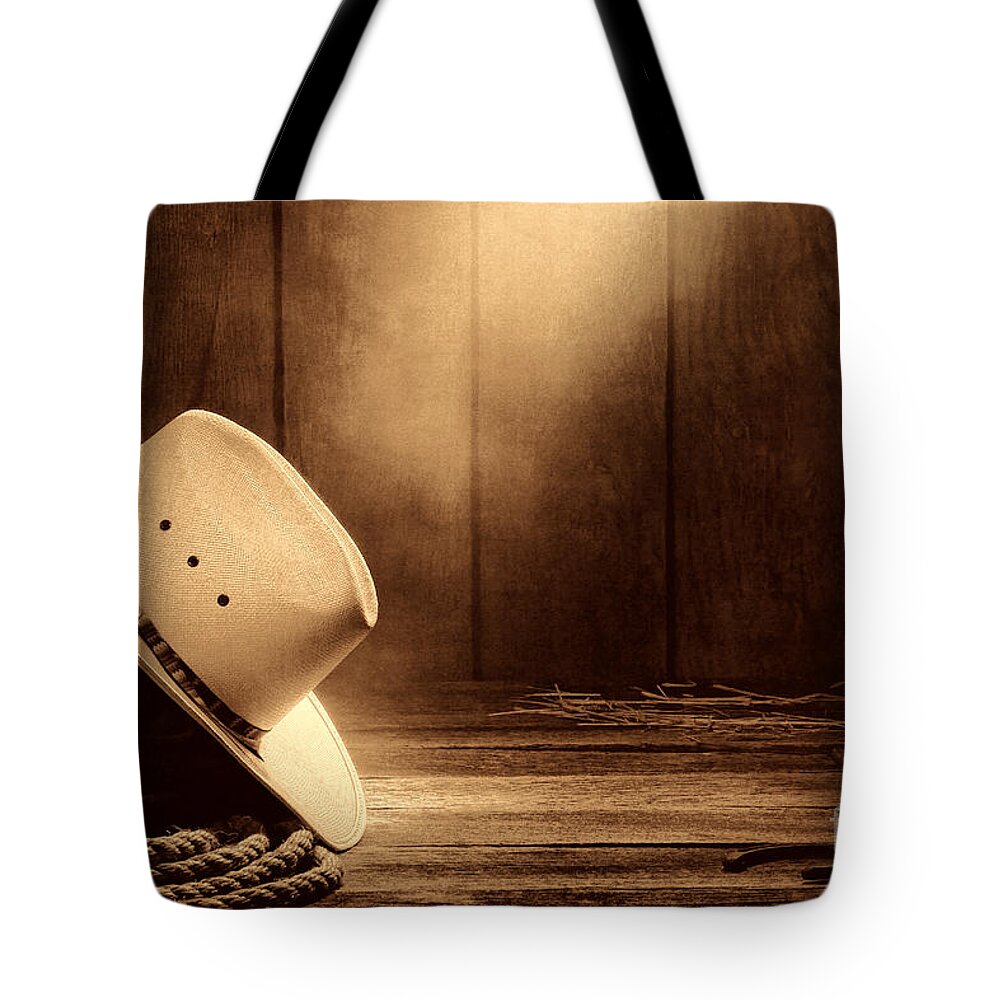Western Tote Bag featuring the photograph Cowboy Hat in the Old Barn by American West Legend By Olivier Le Queinec