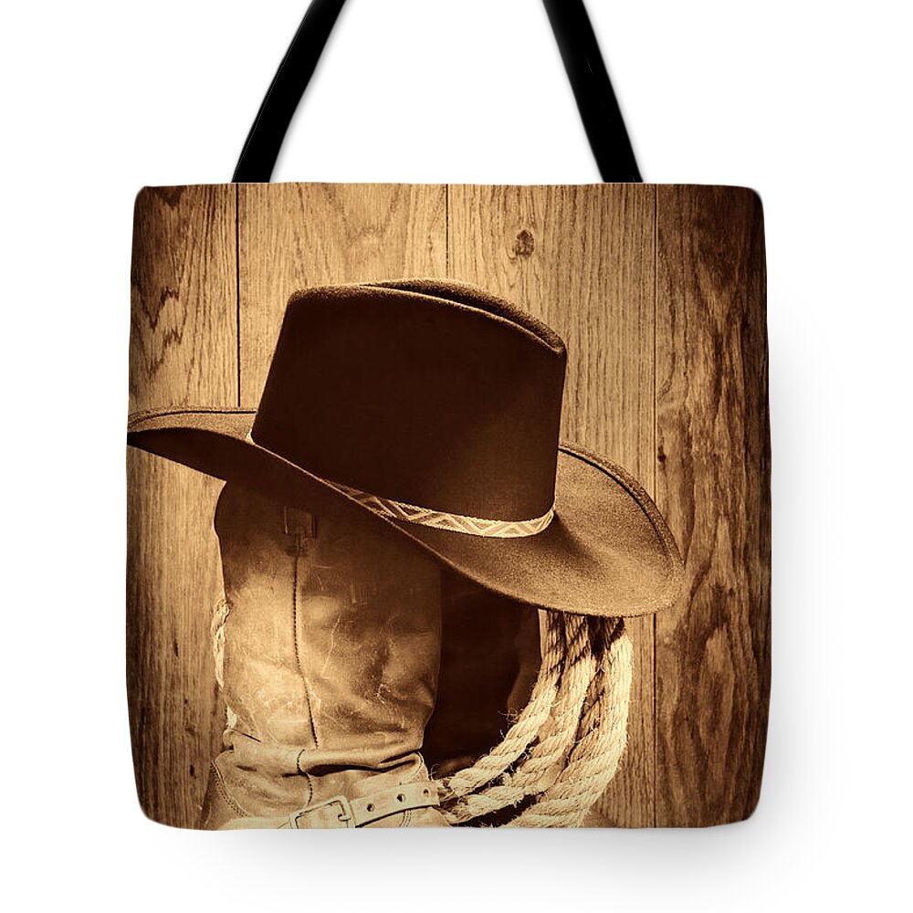 Antique Tote Bag featuring the photograph Cowboy Hat on Boots by American West Legend By Olivier Le Queinec