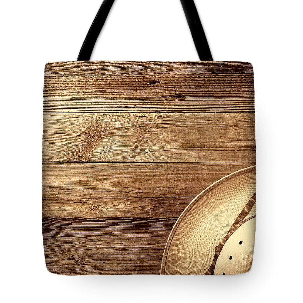 Western Tote Bag featuring the photograph Cowboy Hat on Wood Table by American West Legend By Olivier Le Queinec