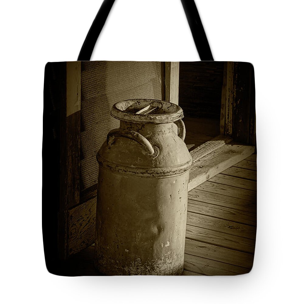 Milk Tote Bag featuring the photograph Creamery Milk Can in Sepia Tone by Randall Nyhof