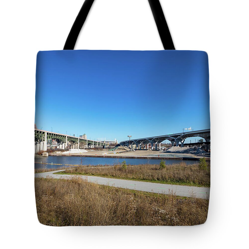 Cleveland Tote Bag featuring the photograph Cuyahoga Bridges by Tim Fitzwater