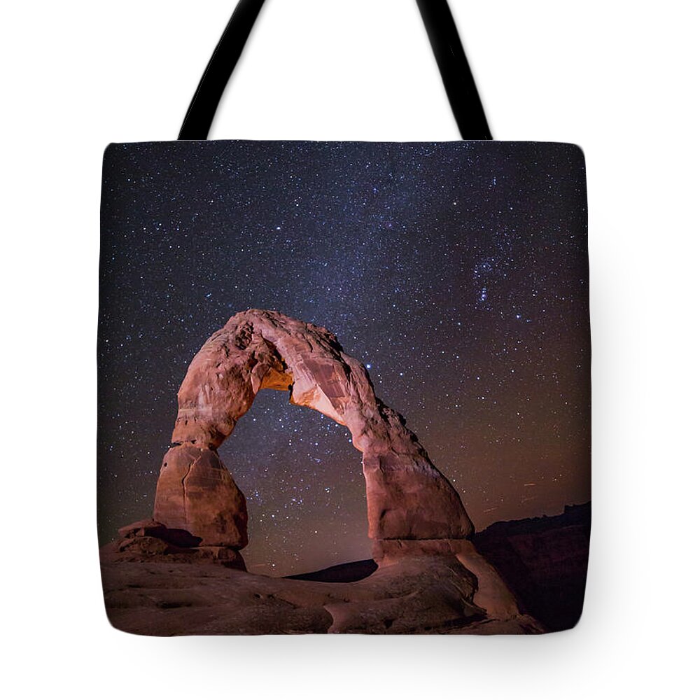 Delicate Arch Tote Bag featuring the photograph Delicate at night by Joe Kopp