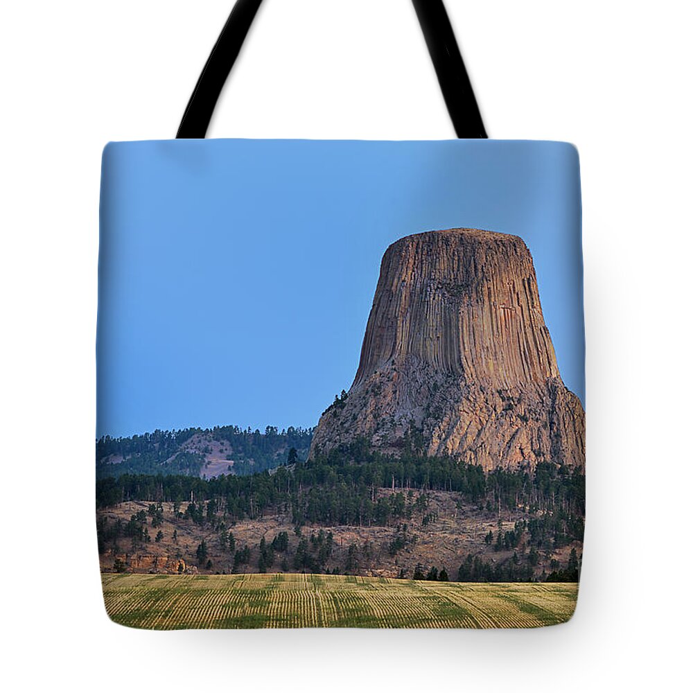 Devils Tower Wyoming Rock Stone National Park Monument Tote Bag featuring the photograph Devils' Tower at Sunrise 6761 by Ken DePue