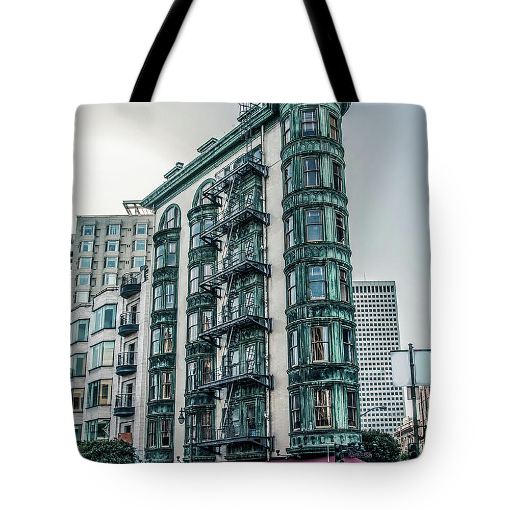 Buildings Tote Bag featuring the photograph Dez 2016. San Francisco, USA - Old copper-green Columbus tower o by Amanda Mohler