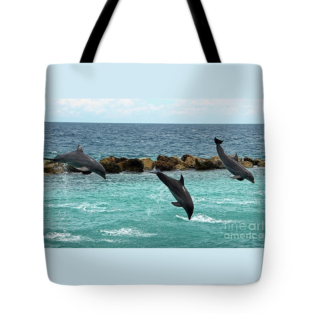 Dolphins Tote Bag featuring the photograph Dolphins Showtime by Adriana Zoon