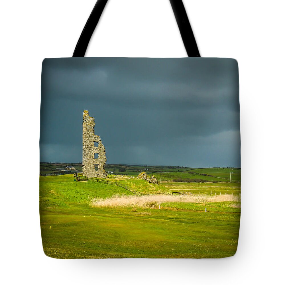 14th Century Tote Bag featuring the photograph Dough Castle in Ireland's County Clare by James Truett