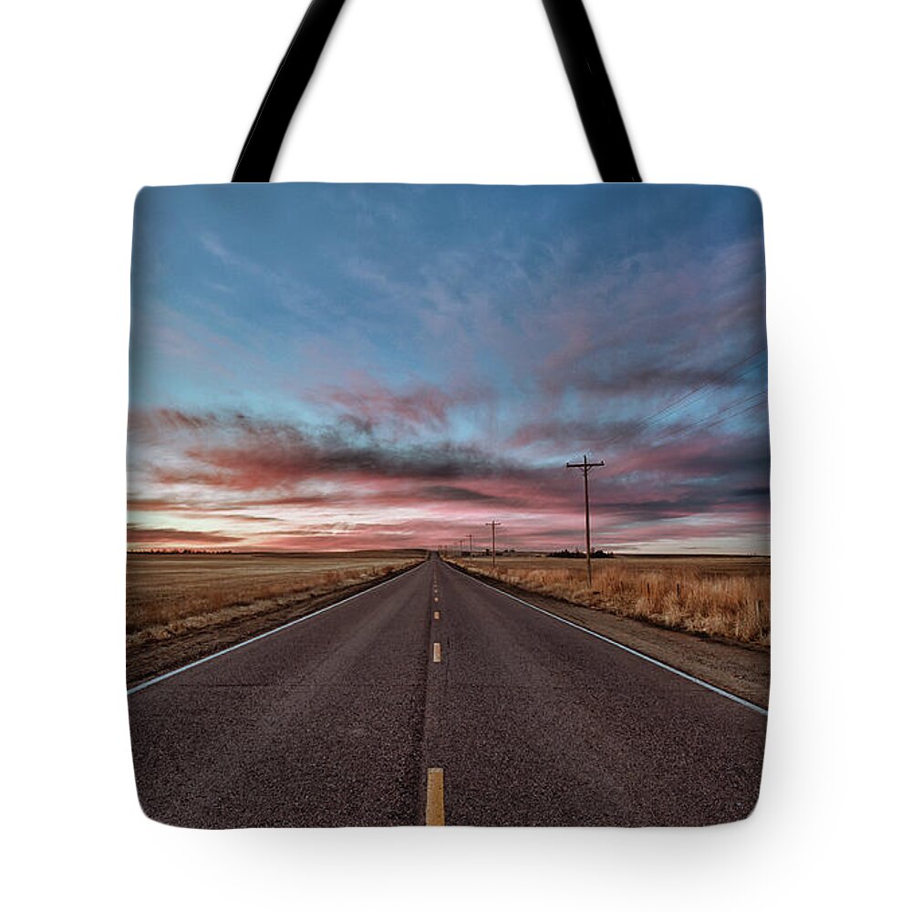 Sunset Tote Bag featuring the photograph Down the Road by Monte Stevens