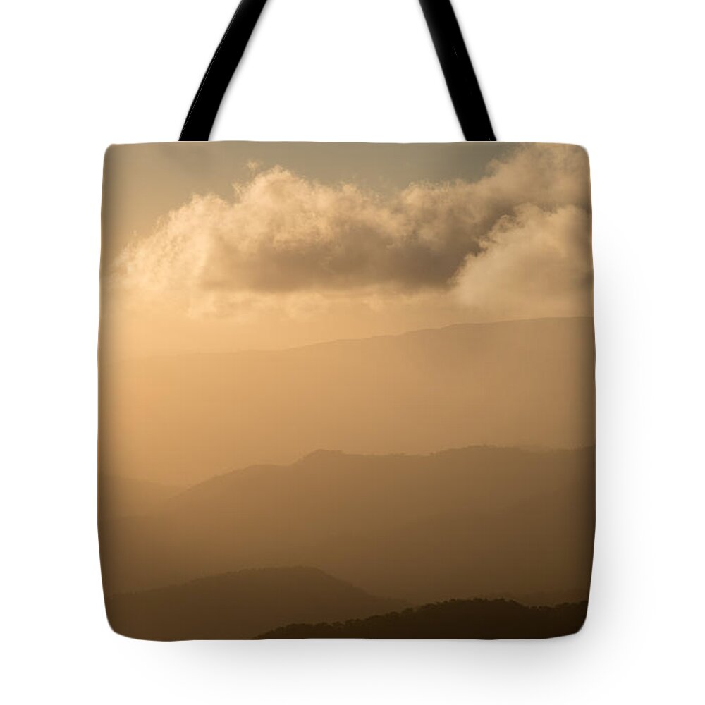 Sundown Tote Bag featuring the photograph Dramatic idyllic sunset with orange colors by Michalakis Ppalis