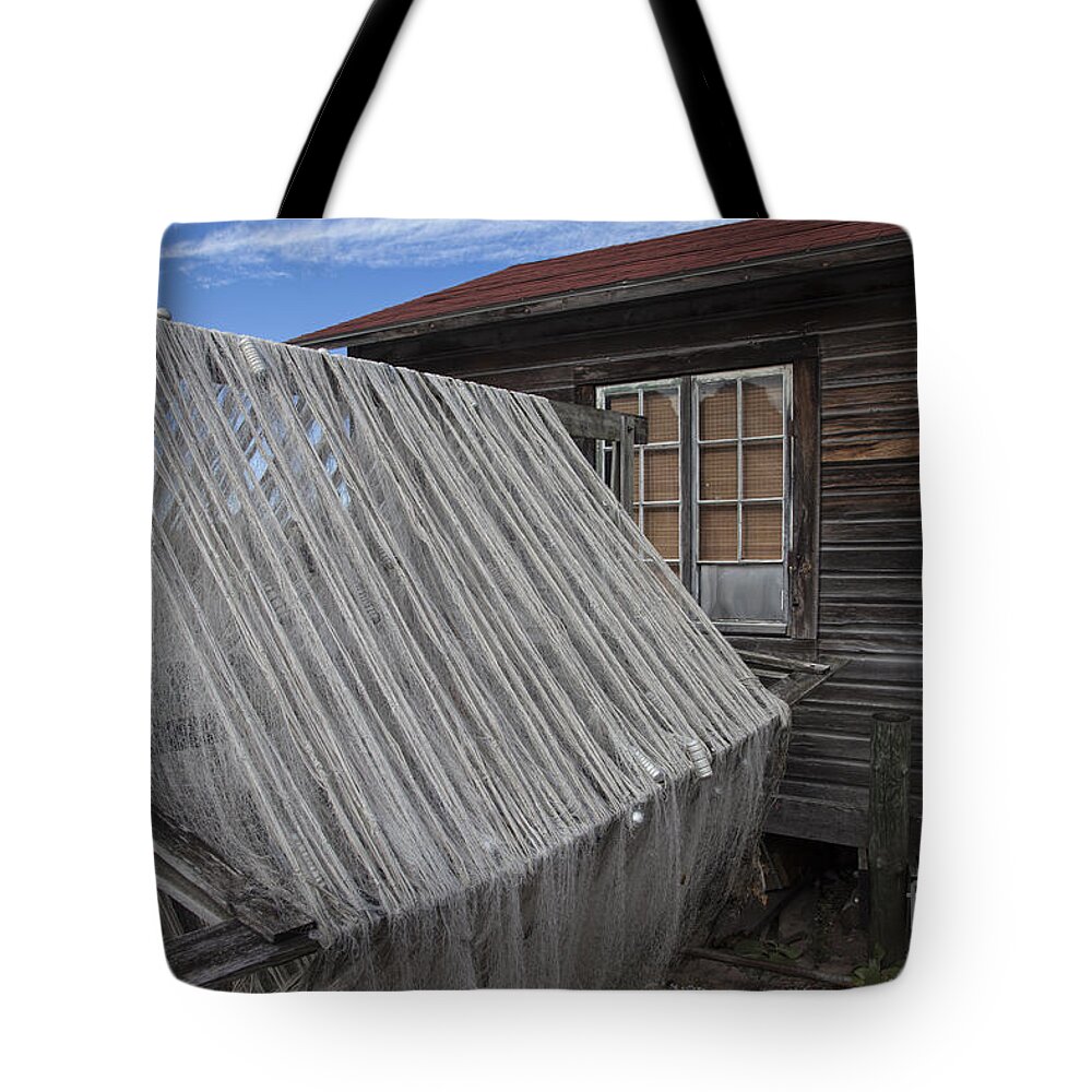Fishing Tote Bag featuring the photograph Drying the Nets by Timothy Johnson