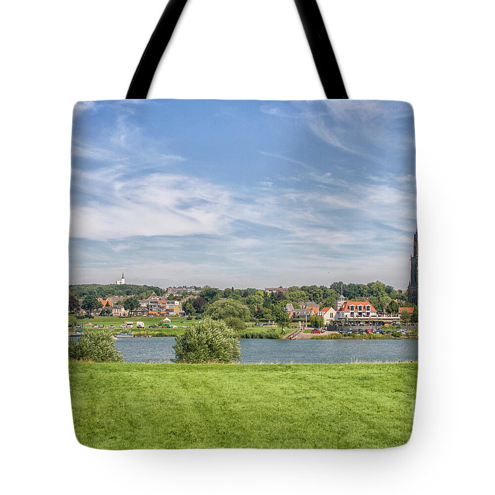 Architecture Tote Bag featuring the photograph Dutch village near the Rhine by Patricia Hofmeester