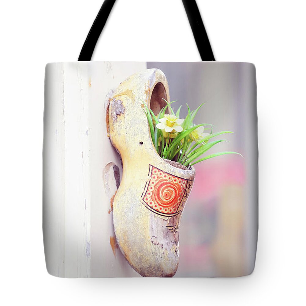 Jenny Rainbow Fine Art Photography Tote Bag featuring the photograph Dutch Wooden Shoe Floral Decor by Jenny Rainbow