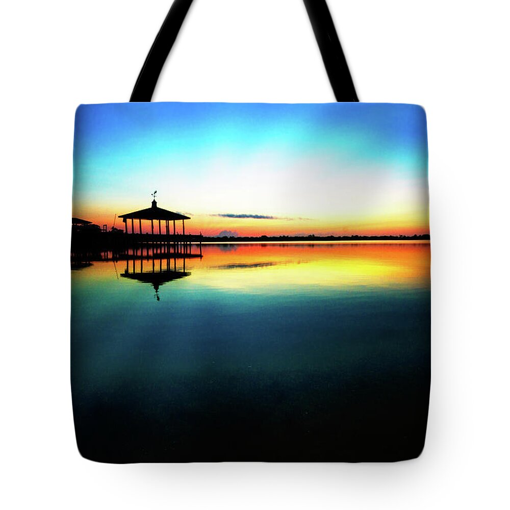 Clouds Tote Bag featuring the photograph Early Morning Rays over the Boat House by Debra and Dave Vanderlaan