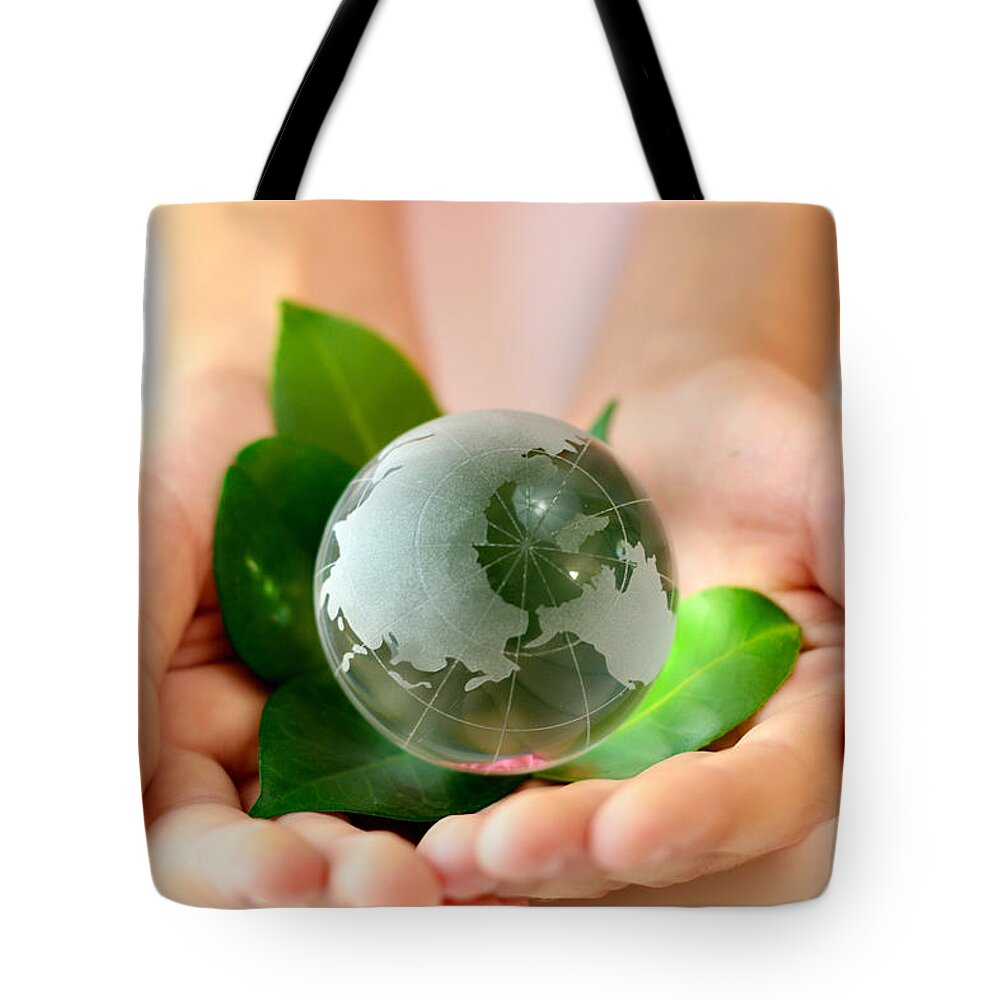 Eco Tote Bag featuring the photograph Eco Hands And Globe by Serena King