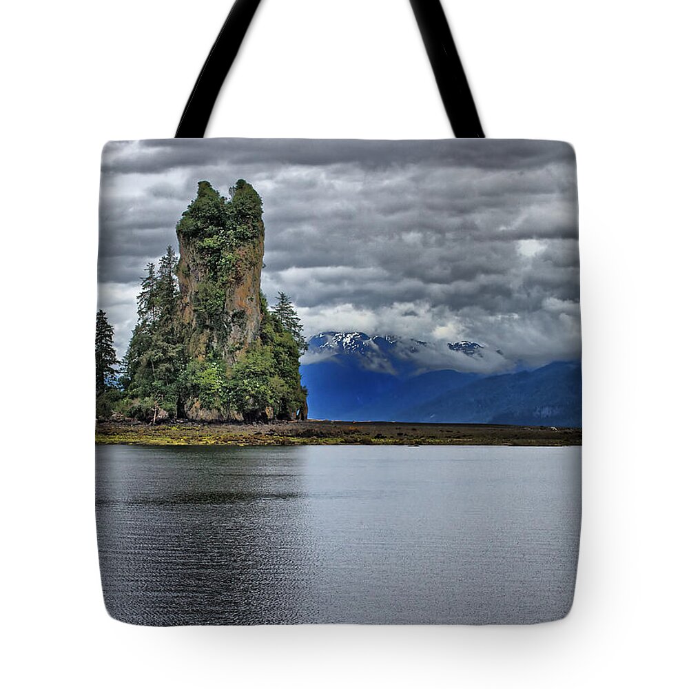 Eddystone Tote Bag featuring the photograph Eddystone Rock in Misty Fjords National Monument by Farol Tomson