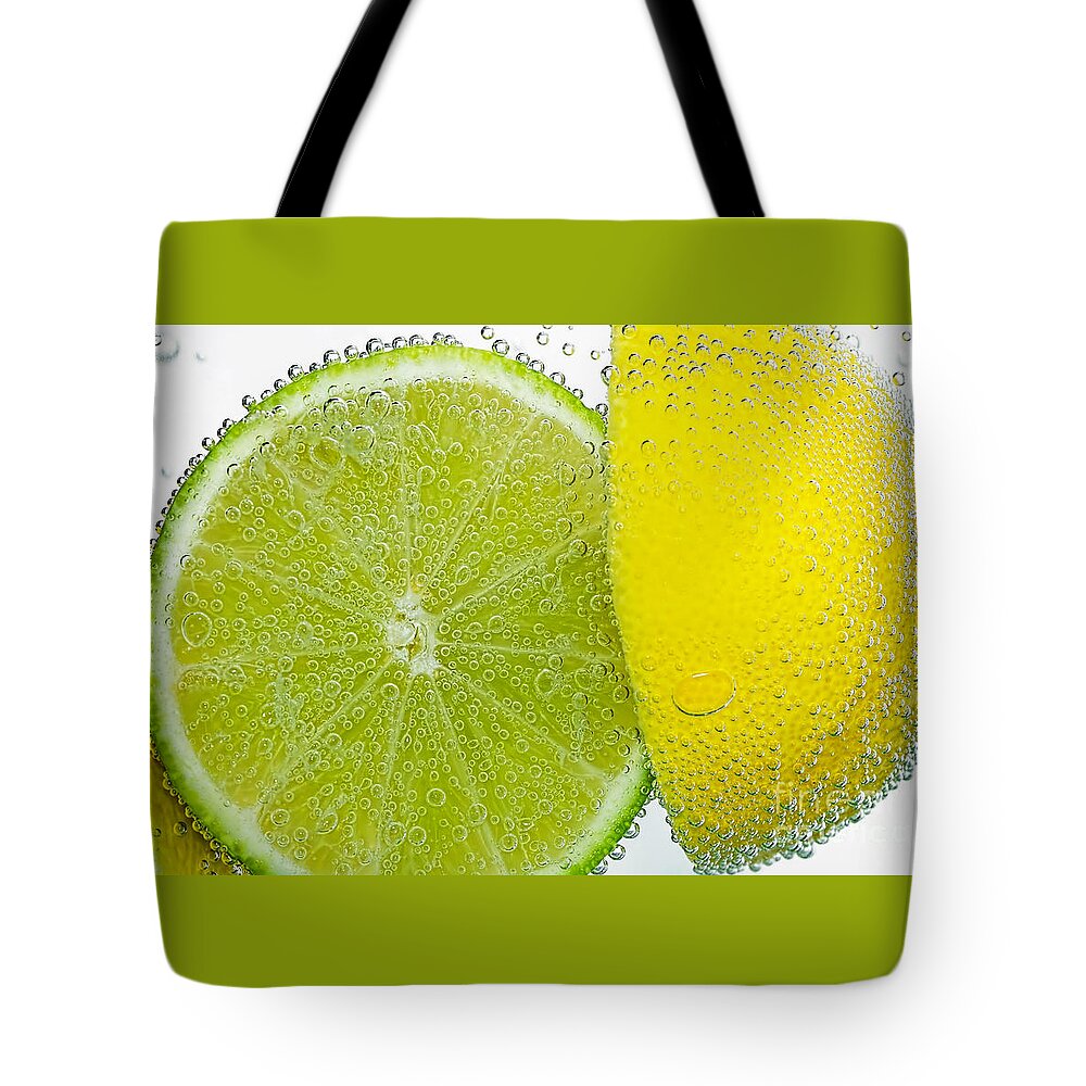 Effervescent Lime And Lemon Tote Bag featuring the photograph Effervescent Lime and Lemon by Kaye Menner by Kaye Menner