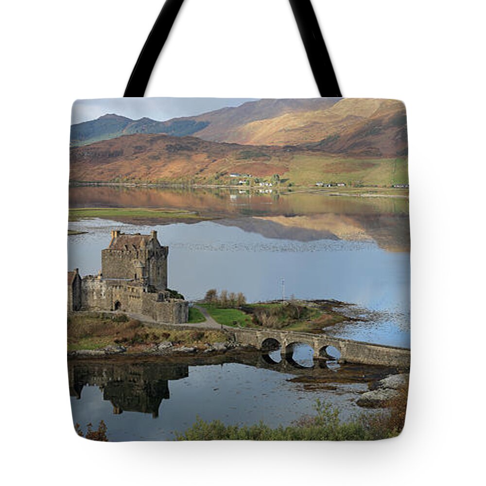 Eilean Donan Castle Tote Bag featuring the photograph Eilean Donan Castle in Autumn - Panorama by Maria Gaellman