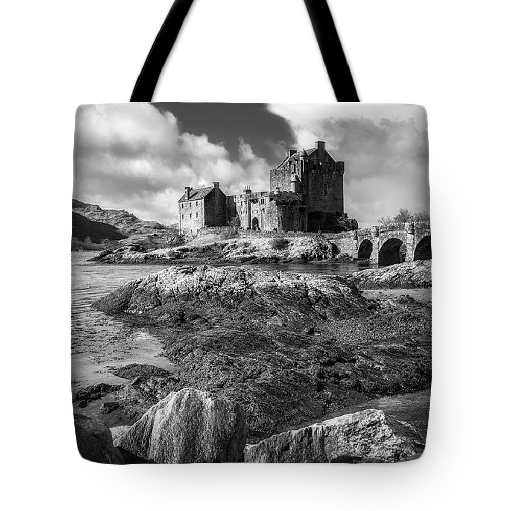 Eilean Donan Tote Bag featuring the photograph Eilean Donan Castle in black and white by Holly Ross