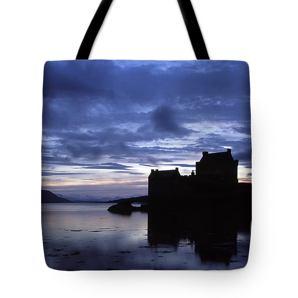 Eilean Donan Tote Bag featuring the photograph Eilean Donan Castle over Loch Duich. by John Paul Cullen