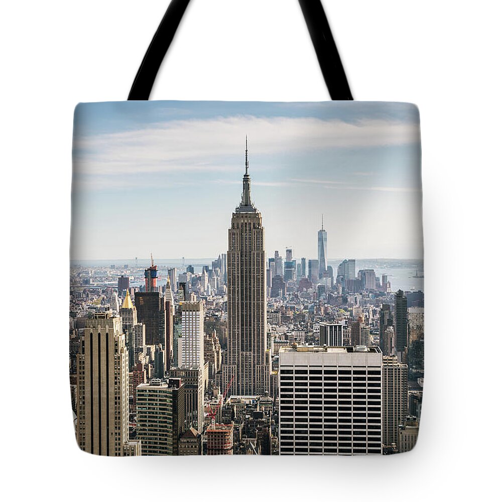 New York Tote Bag featuring the photograph Empire State building and Manhattan skyline, New York city, USA by Matteo Colombo