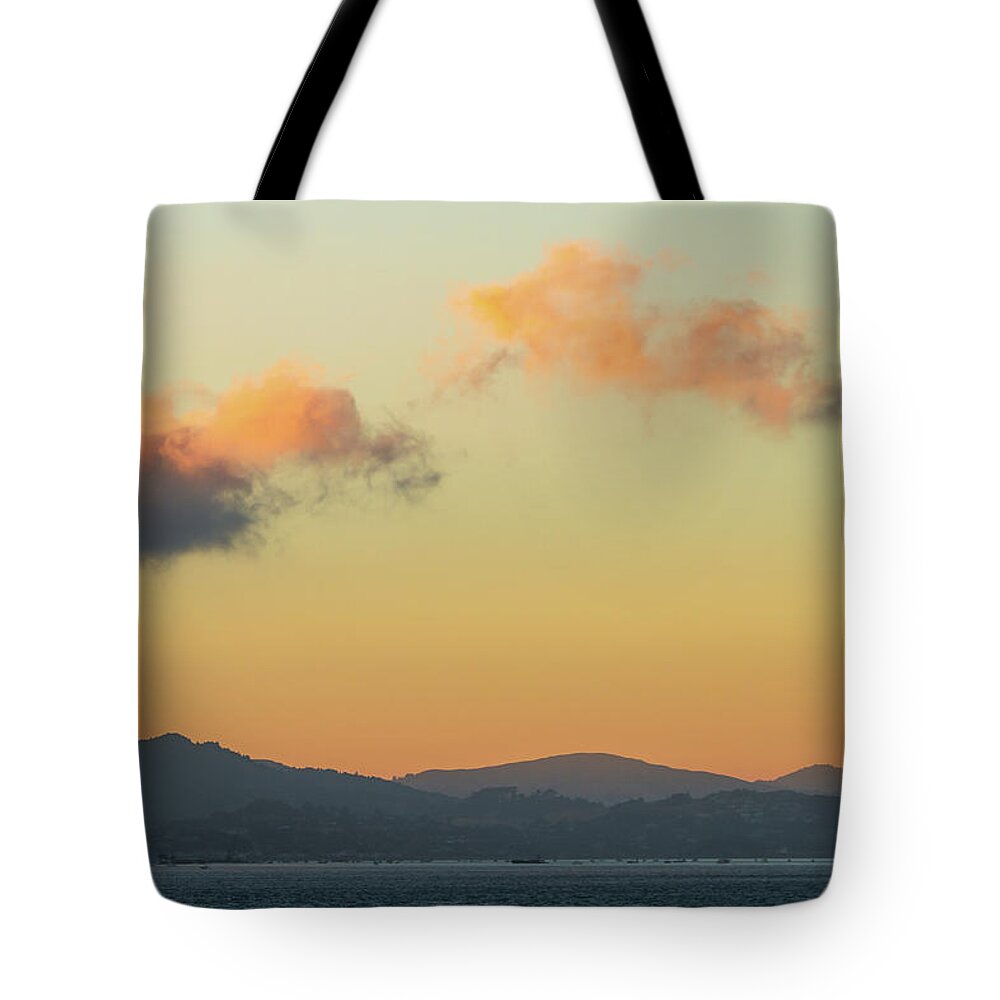 Evening Clouds Over The Bay Tote Bag featuring the photograph Evening Clouds Over The Bay by Bonnie Follett