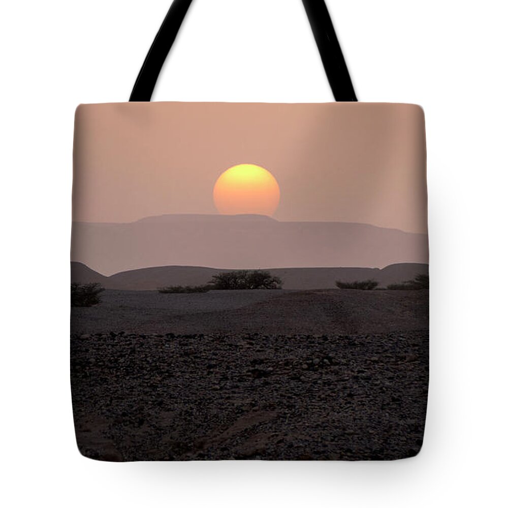 Sunset Tote Bag featuring the photograph Evening falls on the prairie by Arik Baltinester